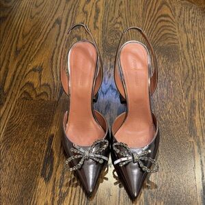 Amina Muaddi Metallic Heels with Crystal Bow
